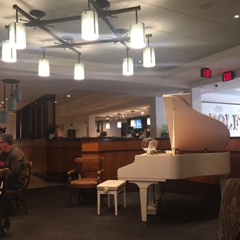 Chef Rolf's New Florida Kitchen - Piano, with bar in background - Seafood Near Me - Osprey, Florida Chef Rolf's New Florida Kitchen - Piano, with bar in background - Seafood Near Me - Osprey, Florida