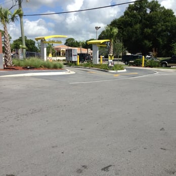 McDonald's - an empty parking lot with a mcdonald's sign in the background - Burgers Near Me - Okeechobee, Florida