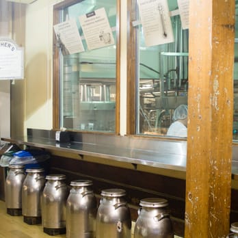 Beecher's Handmade Cheese - Small bar area for eats and viewing pleasure. Sit on the old school milk stools. - Cheese Shops Near Me - Seattle, Washington Beecher's Handmade Cheese - Small bar area for eats and viewing pleasure. Sit on the old school milk stools. - Cheese Shops Near Me - Seattle, Washington