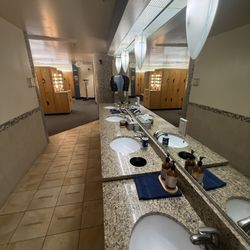 Full row of sinks and lockers in our spacious locker room.