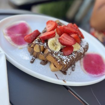 Seymour's Cafe - Nutella waffles with strawberry and bananas. - Bagels Near Me - Livingston, New Jersey Seymour's Cafe - Nutella waffles with strawberry and bananas. - Bagels Near Me - Livingston, New Jersey