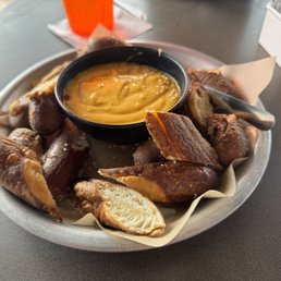 "Creamy melted cheese" is not what the pretzels come with. Nacho cheese is, which isn't real cheese but a cheese "product". 1/5 stars. "Creamy melted cheese" is not what the pretzels come with. Nacho cheese is, which isn't real cheese but a cheese "product". 1/5 stars.