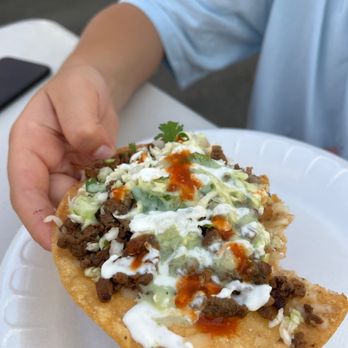 Don Tacos - Taco vampiros (description: tostada with melted mozzarella, asada, cabbage, cilantro, crema, guacamole salsa, red and green salsa) - Food Trucks Near Me - Fresno, California Don Tacos - Taco vampiros (description: tostada with melted mozzarella, asada, cabbage, cilantro, crema, guacamole salsa, red and green salsa) - Food Trucks Near Me - Fresno, California