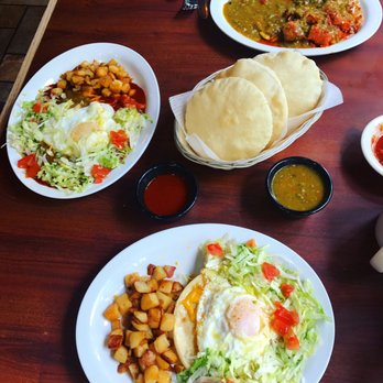 Casa De Benavidez - Delicious "Old Fashion" Breakfast layered Enchiladas with fried egg on top. Side of sopaipillas (YUM)! - Mexican Near Me - Albuquerque, New Mexico