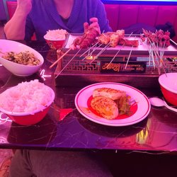 Discovery Fusion BBQ - Cucumber with garlic sauce, white rice, octopus skewers, taiwan sausage, mini beef skewer, bbq pork steak, eggplant, fish tofu, steam bun