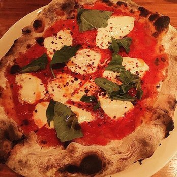 Boutros - The delicious Mozzarella, Tomato, Chili Oil, and Basil Pizza comes with a welcome addition: Aleppo pepper! (IG credit: @gjsomi) - New American Near Me - Brooklyn, New York