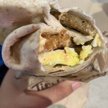 Tim Hortons - a hand holding a breakfast burrito - Bakeries Near Me - Toronto, Ontario Tim Hortons - a hand holding a breakfast burrito - Bakeries Near Me - Toronto, Ontario
