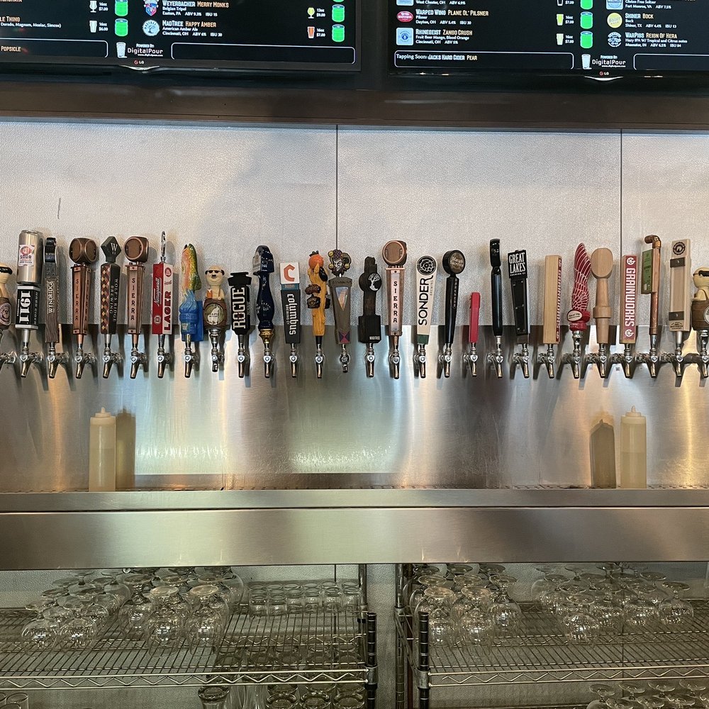 a row of beer taps