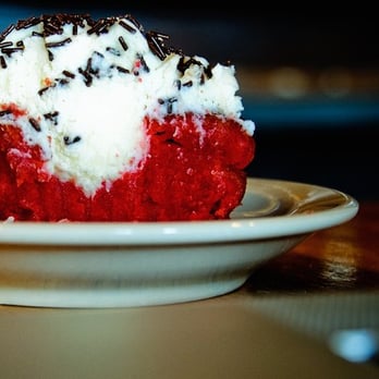 Mozart's Coffee Roasters - red velvet cupcake, demonstrating its impressive cream:cake ratio - Coffee & Tea Near Me - Austin, Texas