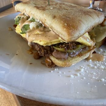 Broken Yolk Cafe - Ciabatta Breakfast Torta w/ beef barbacoa - Cafes Near Me - Palm Springs, California