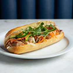 Amarith Farmhouse Restaurant & Pie Shoppe - Chicken Num Pang, grilled chicken with house pickled veggies in a fresh, artisan baguette.