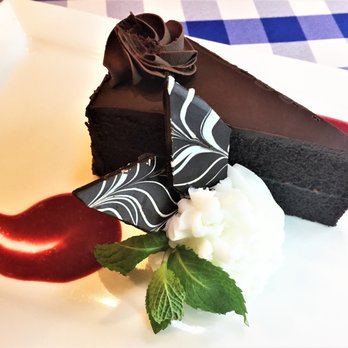 The Berghoff Restaurant - Black Forest Cake Layered chocolate and yellow cakes, sour cherries, raspberry preserve, chocolate mousse, whipped cream, garnished with cho - Bars Near Me - Chicago, Illinois