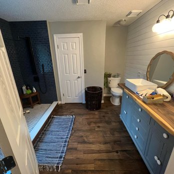 DJ Superior Flooring - a bathroom with wood floors - Flooring Near Me DJ Superior Flooring - a bathroom with wood floors - Flooring Near Me