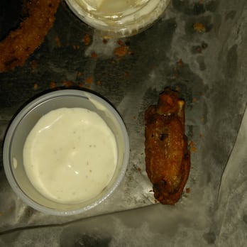 Wings Xpress - Wing size comparison to the dip cup. Sad... sad wings... very disappointed. - American Near Me - Knoxville, Tennessee