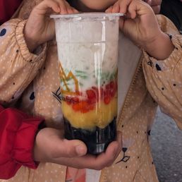 Chè, #10. Mix of grass jelly, mung bean, water chestnut with tapioca, jelly, ice and coconut milk. 16oz. So yummy Chè, #10. Mix of grass jelly, mung bean, water chestnut with tapioca, jelly, ice and coconut milk. 16oz. So yummy