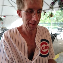 a man in a chicago cubs shirt