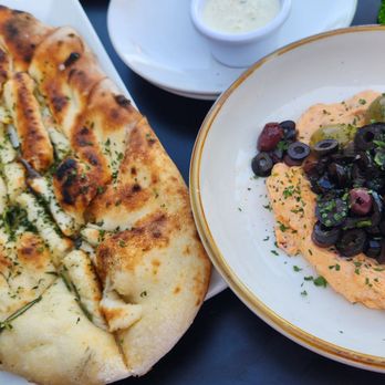FIRED Pizza - Calabrian chili labneh with olive medley and olive oil. Paired with the bread it comes with is a GREAT starter. It was delish! - Pizza Near Me - Stockton, California FIRED Pizza - Calabrian chili labneh with olive medley and olive oil. Paired with the bread it comes with is a GREAT starter. It was delish! - Pizza Near Me - Stockton, California