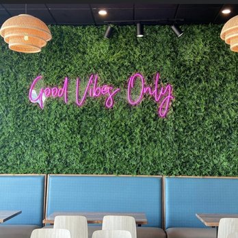 Ohana Hawaiian Grill - a green wall with a good vibe sign - Hawaiian Near Me - Crestview, Florida Ohana Hawaiian Grill - a green wall with a good vibe sign - Hawaiian Near Me - Crestview, Florida