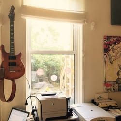Care Practice - Guitar hanging in the back of the office for lunch breaks.