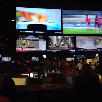Kickback Jack's - Bar area with a wall of TVs. - American Near Me - Greenville, North Carolina Kickback Jack's - Bar area with a wall of TVs. - American Near Me - Greenville, North Carolina