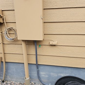 Prosper Electrical Contractors - The conduit and 60A breaker added to our 240v service for our Tesla EV charger ran under our deck. Elijah did a great job! - Electricians Near Me
