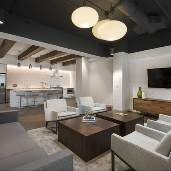 Chestnut Place Apartments - Resident lounge and demonstration kitchen. - Apartments Near Me - Chicago, Illinois Chestnut Place Apartments - Resident lounge and demonstration kitchen. - Apartments Near Me - Chicago, Illinois