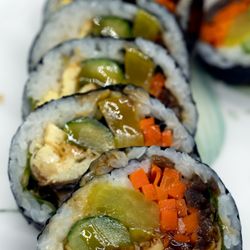 Eel Kimbab: $11; $11.98 with tax for cash. $11.37; $12.38 with tax for credit / debit. Half roll shown. Take-out.