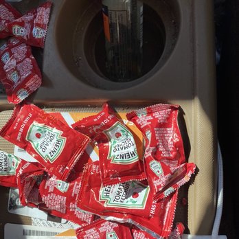 Five Guys - Some of the ketchup packets used to fill my bag. No, I did not ask for ketchup. Ever. Diabetic and celiac. - Burgers Near Me - Mentor, Ohio