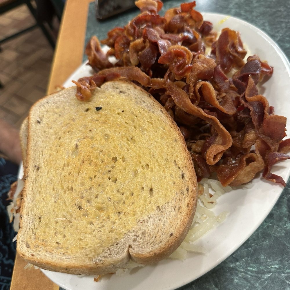 Tony's I-75 Restaurant - Eggs, hash browns and bacon ( the eggs and hash browns are buried) - Diners Near Me - Birch Run, Michigan Tony's I-75 Restaurant - Eggs, hash browns and bacon ( the eggs and hash browns are buried) - Diners Near Me - Birch Run, Michigan