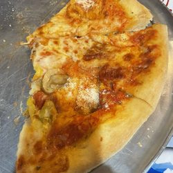 Milano's Italian Cuisine - Pizza with very skimpy toppings. Was supposed to be pepperoni, mushroom, and banana peppers. They were on one slice anyway...