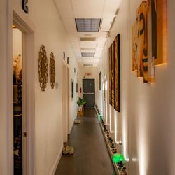 Jaidee Thai Massage - Mood lighting and art create a relaxing mood as you head to your treatment room.