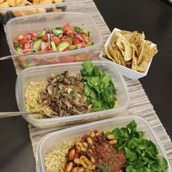 Mavis J. Gourmet - Vegan spread. Quinoa w/Vegan Chili, Quinoa w/ Sautéed baby Potabello mushrooms and fresh Spinach. Cucumber and Tomato salad w/ fresh fruit.