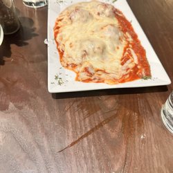Samooni Italian Restaurant - Meatballs - 2 regular size meatballs cut in half to give appearance of 4.  Lots of sauce and cheese, but the sauce is tasty!