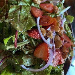 Mixed greens salad with strawberries and candied macadamia nuts