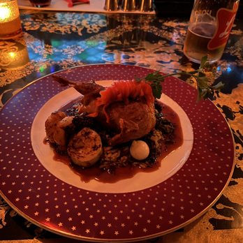 L'Opossum - a plate of food on a table - New American Near Me - Richmond, Virginia
