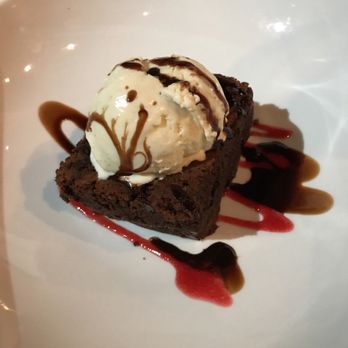 The Twisted Fork - Classic vanilla brownie sundae with chocolate and raspberry sauce!! - New American Near Me - Reno, Nevada The Twisted Fork - Classic vanilla brownie sundae with chocolate and raspberry sauce!! - New American Near Me - Reno, Nevada