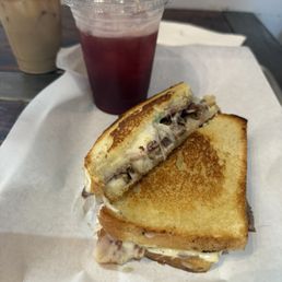 Blackberry flavored sparkling lemonade with Philly cheese steak sandwich
