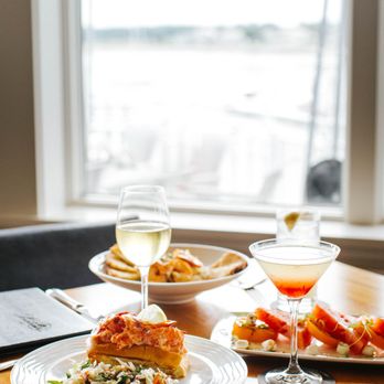 Latitudes - Wentworth By The Sea - two plates of food and a glass of wine - Seafood Near Me - New Castle, New Hampshire