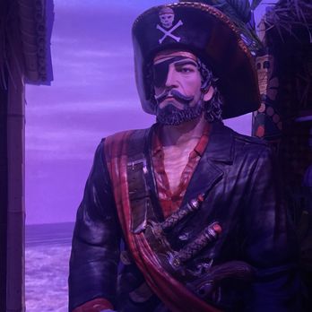 ShipWreck - Pirate statue guards the exit. - Tiki Bars Near Me - Fort Worth, Texas