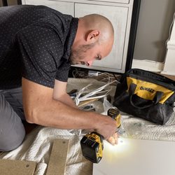 Low Tide Home Services - Assembly of walk-in closet components.