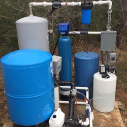 Browns Water Well - 86 gallon pressure tank, peroxide injector, 120 gallon retention tank, 5 micron sediment filter, and a softener on a slab with the well