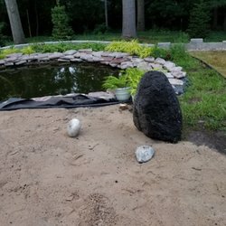 Greenscape's Lawn Maintenance and Landscaping - Boulder Installation