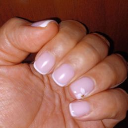 Classic French gel manicure with a cherry blossom flower!