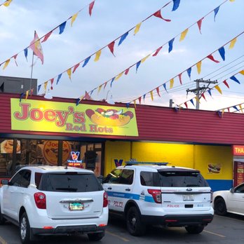 Joey's Red Hots - cars parked in a parking lot - Hot Dogs Near Me - Chicago, Illinois