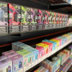 Red Star Vapor & Smoke - Disposable vape shelves displaying Geek Bar