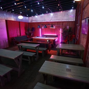 St. Dymphna's - Our back patio, with ample seating, a projector and screen and pool table. - Irish Pub Near Me - New York, New York