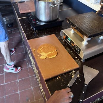 Melly's Stroopwafels - Learn how the process works, and try it first yourself to see if you are a natural - Waffles Near Me - Amsterdam, New Hampshire