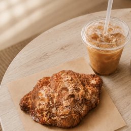 Vanilla iced coffee and almond croissant