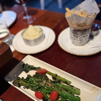 The Ranch - Grilled Broccolini & Tomatoes, Hand-Cut Fries, Herbed Whipped Potatoes - Steakhouses Near Me - Irving, Texas The Ranch - Grilled Broccolini & Tomatoes, Hand-Cut Fries, Herbed Whipped Potatoes - Steakhouses Near Me - Irving, Texas