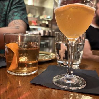 Vaca - L: Old Fashioned ; R: mocktail - Starling - NA Amaro Lucano, Seedlip Spice 94, Blood Orange Infused Lyres NA London Dry, Peppermint, Lemon. - Tapas/Small Plates Near Me - Costa Mesa, California